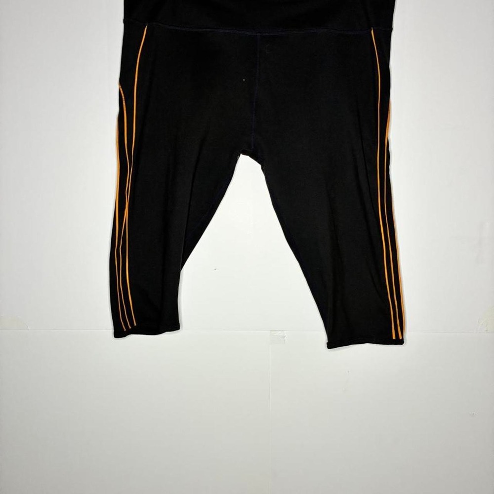 Black capri leggings with gold stripes